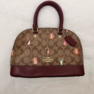 Like New! Adorable Burgundy Couch Bag Printed W/ Logo and cartoon animals!